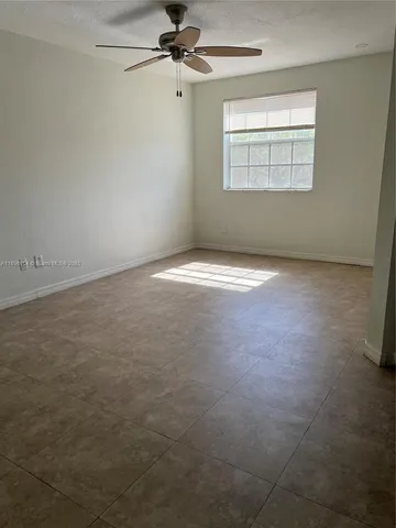 an empty room with a empty space and a window