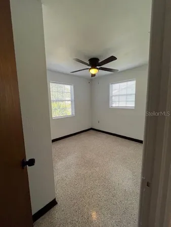 an empty room with windows