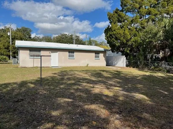 a backyard of a house with lots of green space