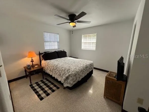 a bedroom with furniture and a window