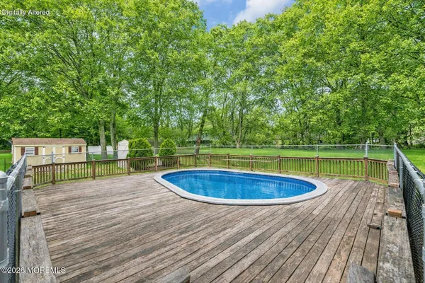 a view of swimming pool with a patio