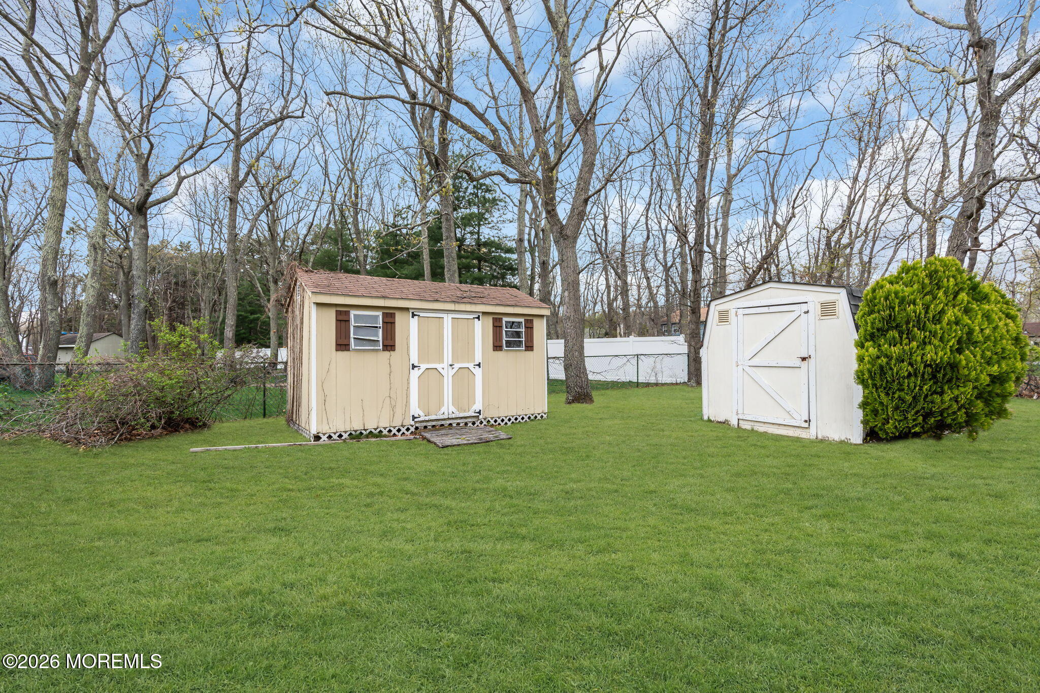 15 Partree Road Jackson, NJ 08527 - Photo 26 of 28 a view of a white house with a big yard and large trees