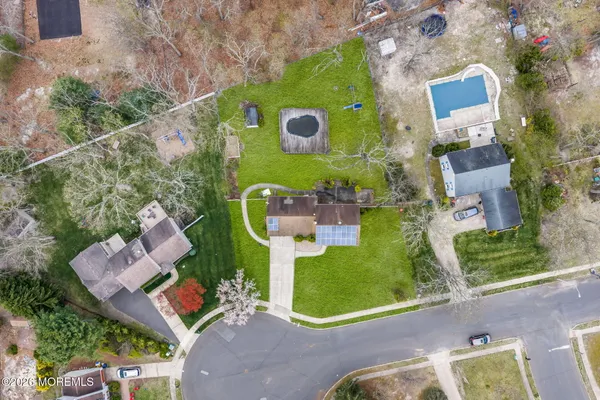 an aerial view of a house with a garden