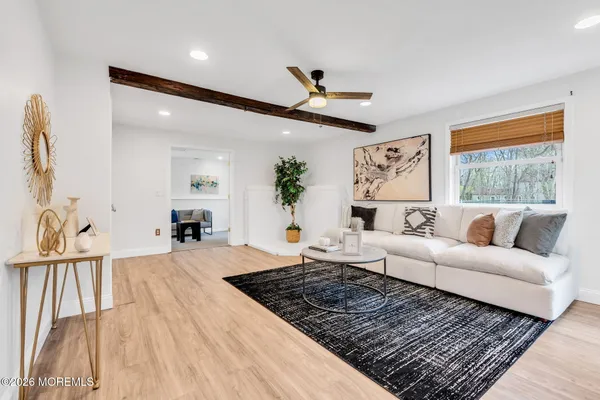 a living room with furniture and a rug