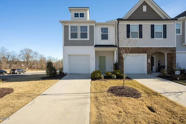 a front view of a house with yard