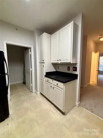 a kitchen with stainless steel appliances a stove a microwave and a refrigerator