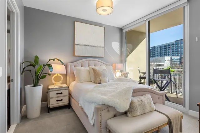 a bedroom with a bed and a couch