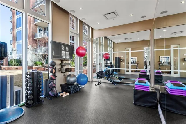 a living room with lots of furniture and a flat screen tv