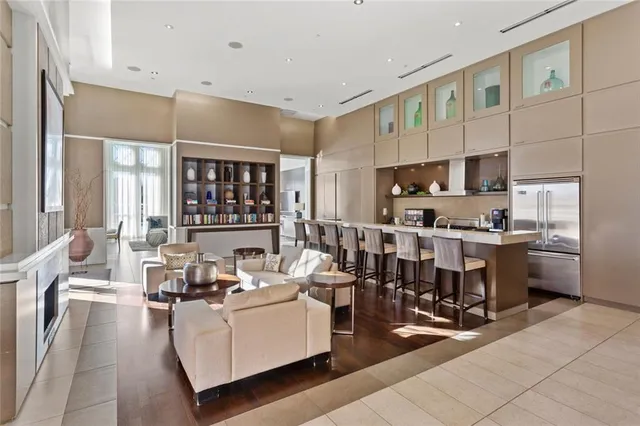 a living room with stainless steel appliances kitchen island granite countertop furniture and a kitchen view