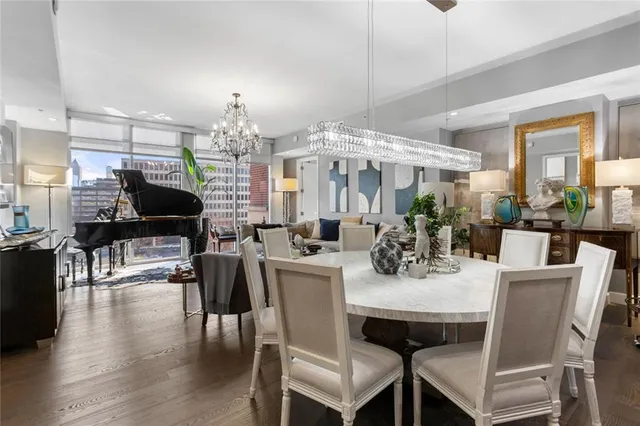 a view of a dining room with furniture window and wooden floor