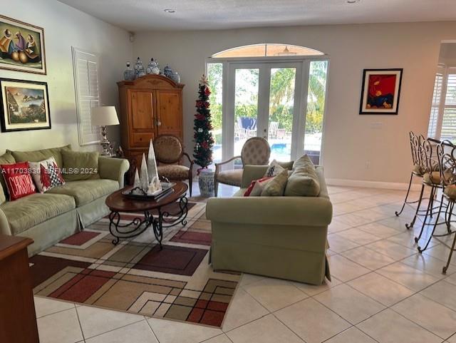 10601 Southwest 128th Street Miami, FL 33176 - Photo 14 of 30 a living room with furniture a lamp wooden floor and a large window