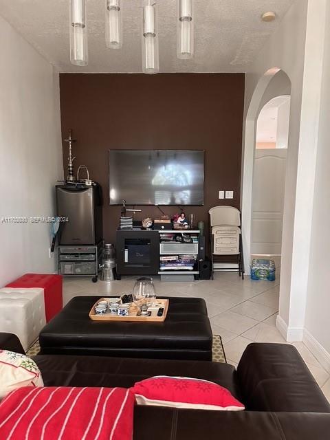 10601 Southwest 128th Street Miami, FL 33176 - Photo 16 of 30 a living room with furniture and a fireplace