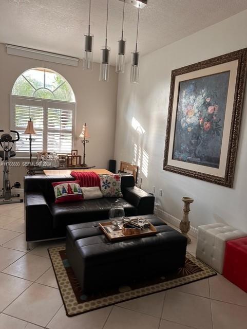 10601 Southwest 128th Street Miami, FL 33176 - Photo 17 of 30 a living room with furniture a large window and a chandelier