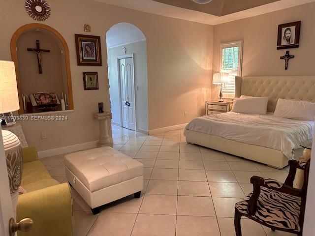 10601 Southwest 128th Street Miami, FL 33176 - Photo 24 of 30 a bedroom with a bed couch and mirror