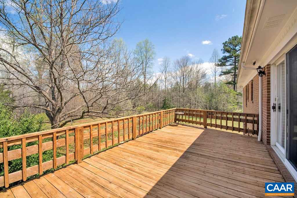 2163 Gold Mine Road Palmyra, VA 22963 - Photo 17 of 49 a view of balcony with wooden floor and fence