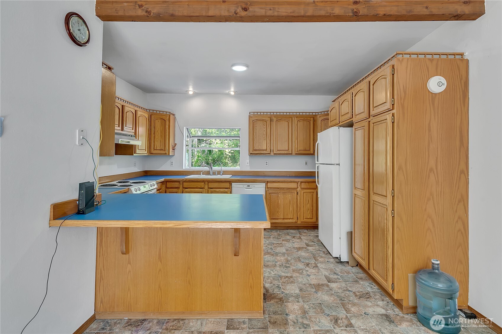 3253 Southeast Arcadia Road Shelton, WA 98584 - Photo 12 of 39 a kitchen with stainless steel appliances granite countertop a refrigerator a sink and a stove
