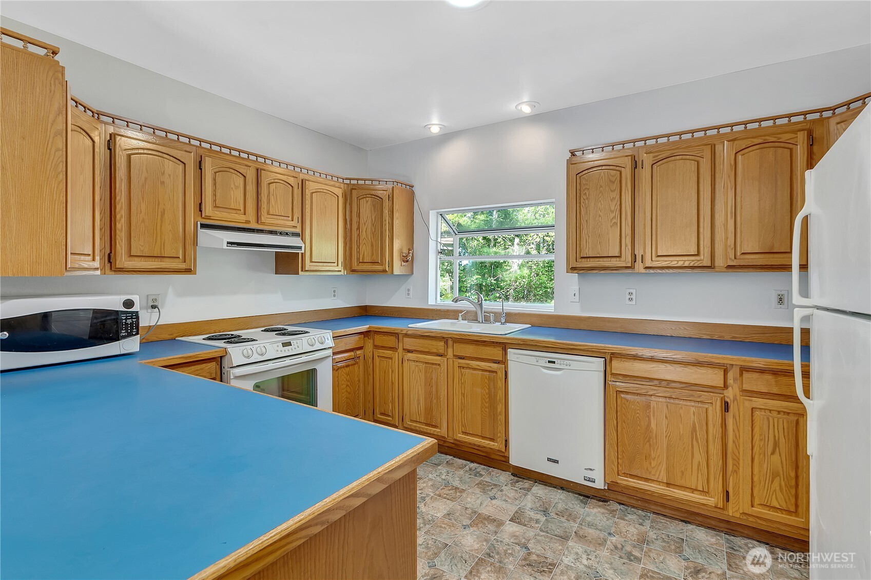3253 Southeast Arcadia Road Shelton, WA 98584 - Photo 13 of 39 a kitchen with stainless steel appliances granite countertop a sink stove and microwave