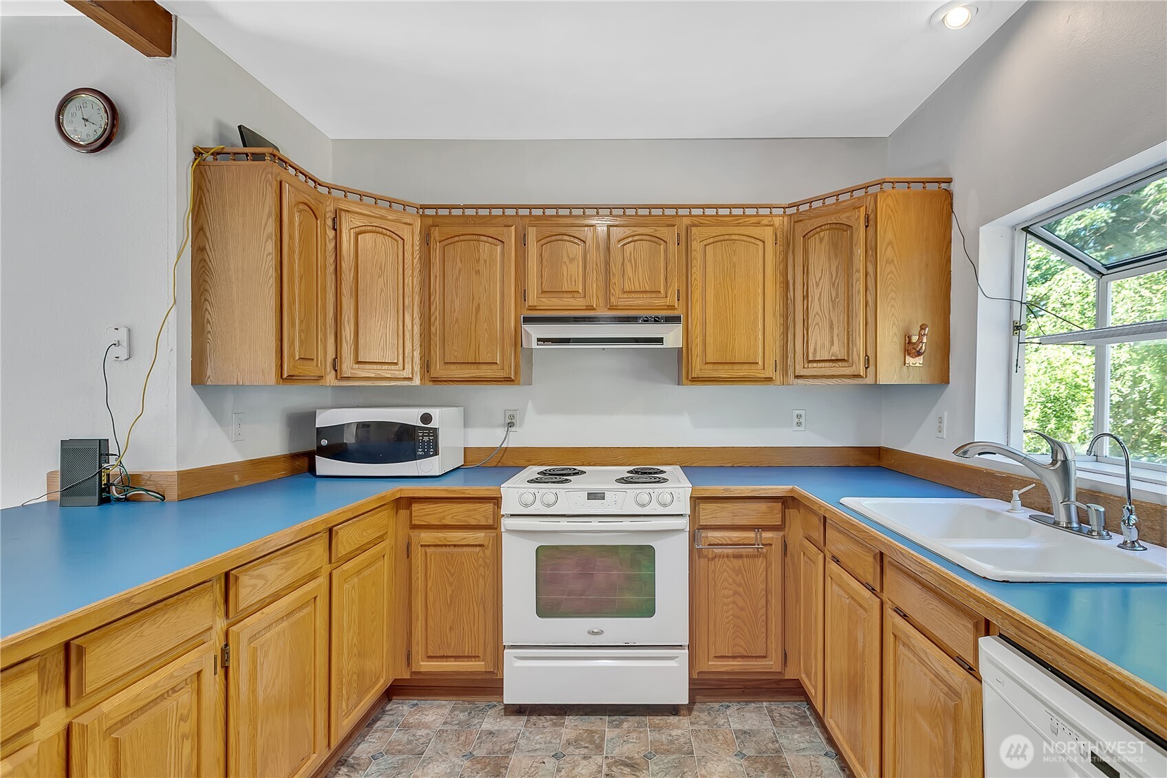 3253 Southeast Arcadia Road Shelton, WA 98584 - Photo 14 of 39 a kitchen with cabinets appliances a sink and a window