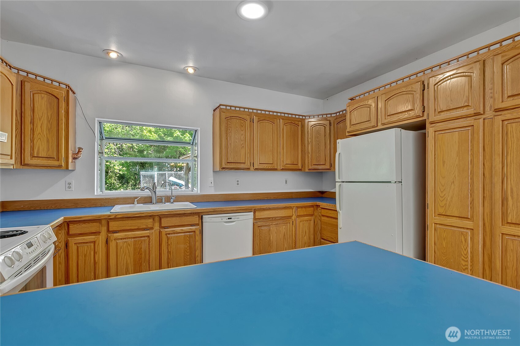 3253 Southeast Arcadia Road Shelton, WA 98584 - Photo 15 of 39 a kitchen with stainless steel appliances granite countertop a refrigerator sink and cabinets