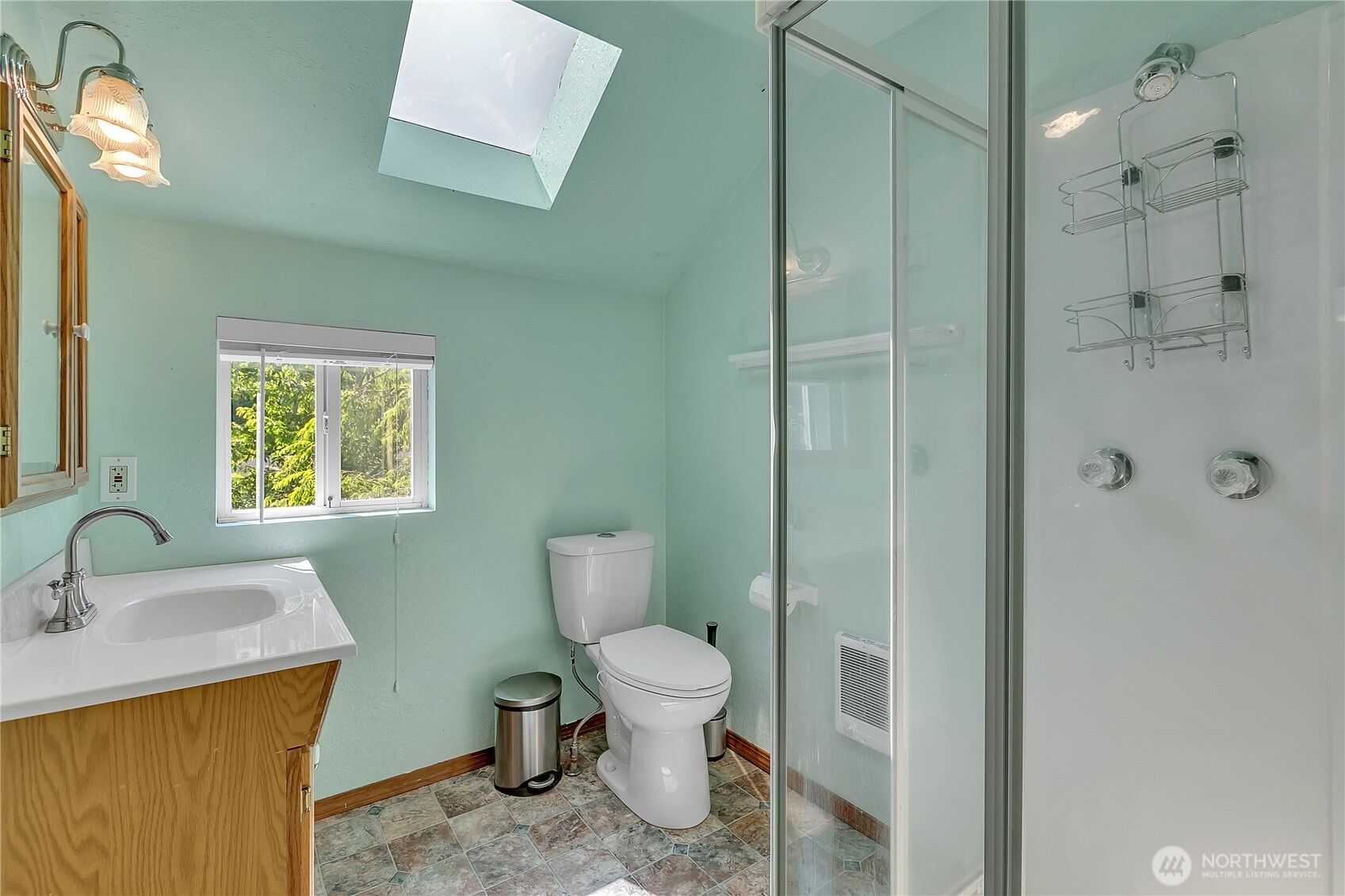 3253 Southeast Arcadia Road Shelton, WA 98584 - Photo 20 of 39 a bathroom with a toilet sink a mirror and shower