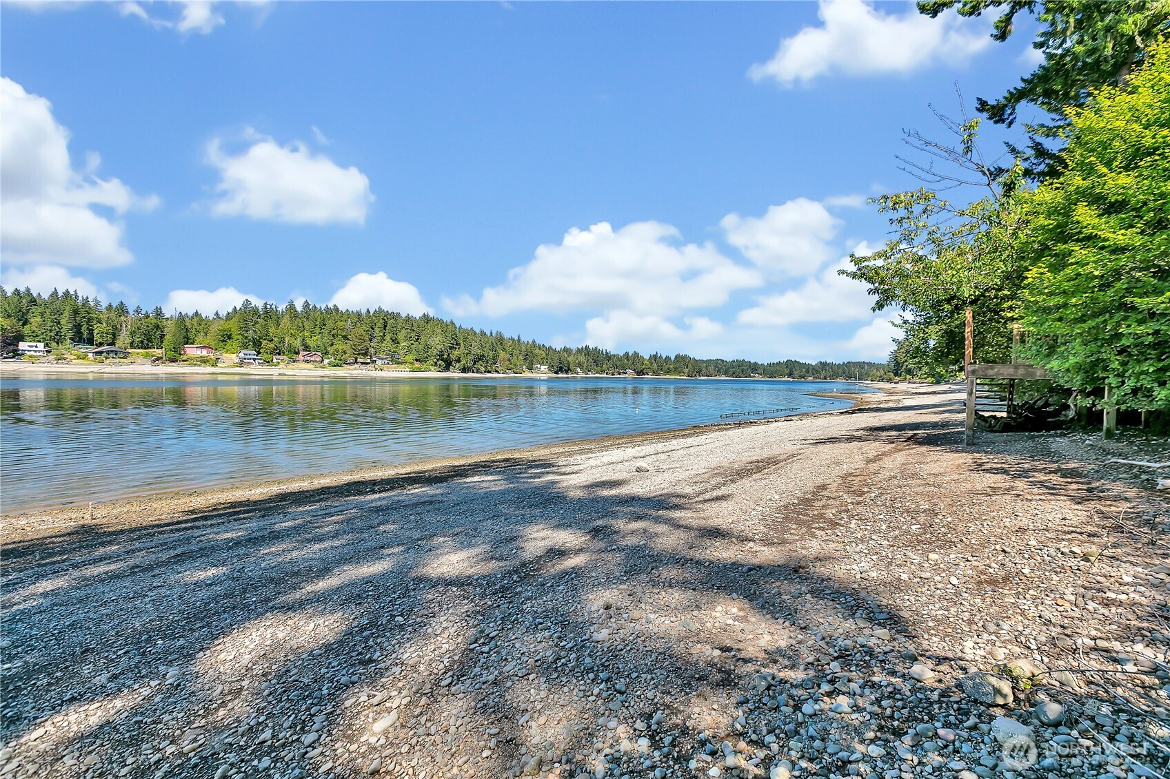 3253 Southeast Arcadia Road Shelton, WA 98584 - Photo 2 of 39 a view of a lake with houses in the background
