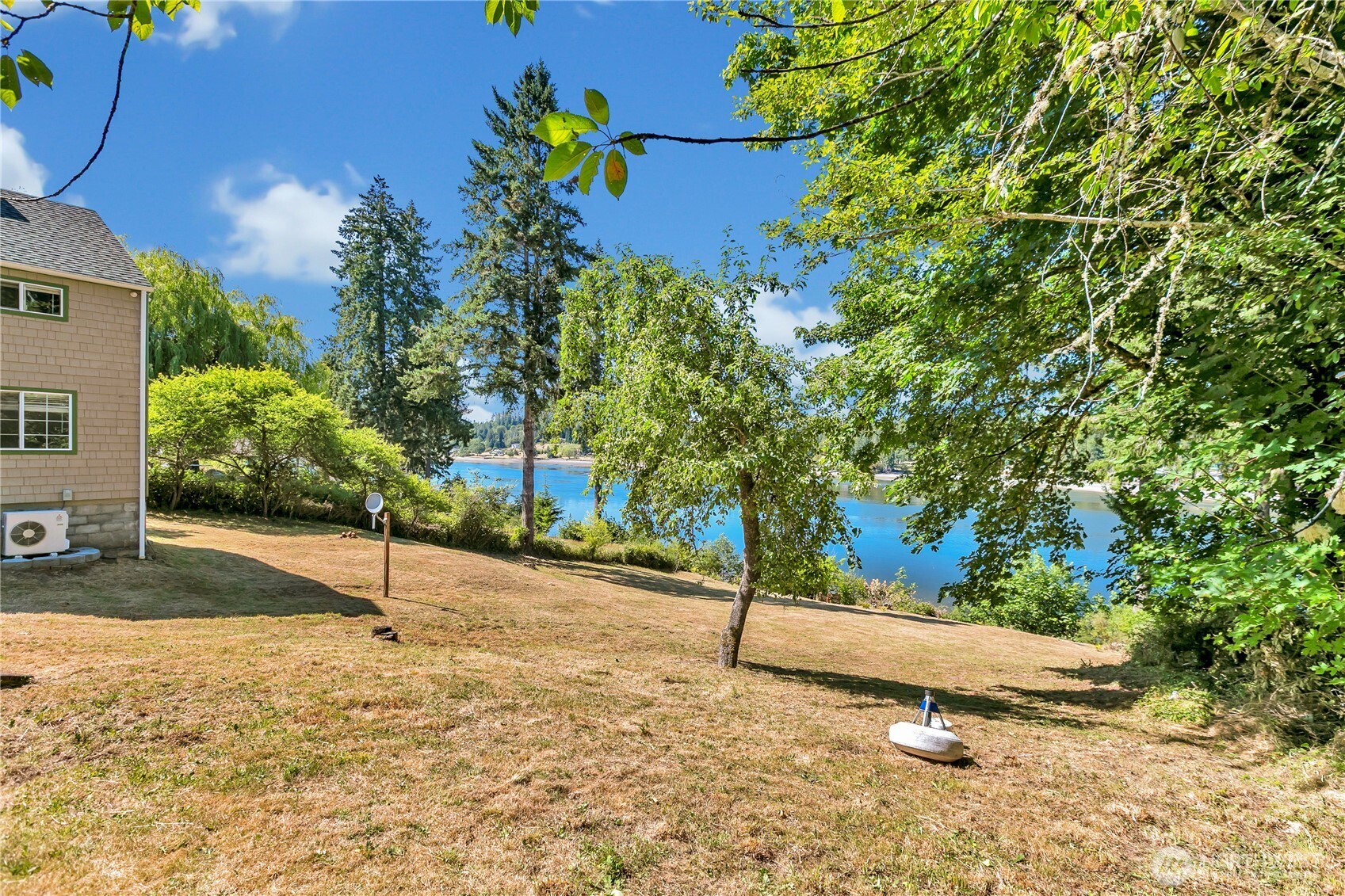 3253 Southeast Arcadia Road Shelton, WA 98584 - Photo 27 of 39 a blue sign that is sitting in the middle of a yard