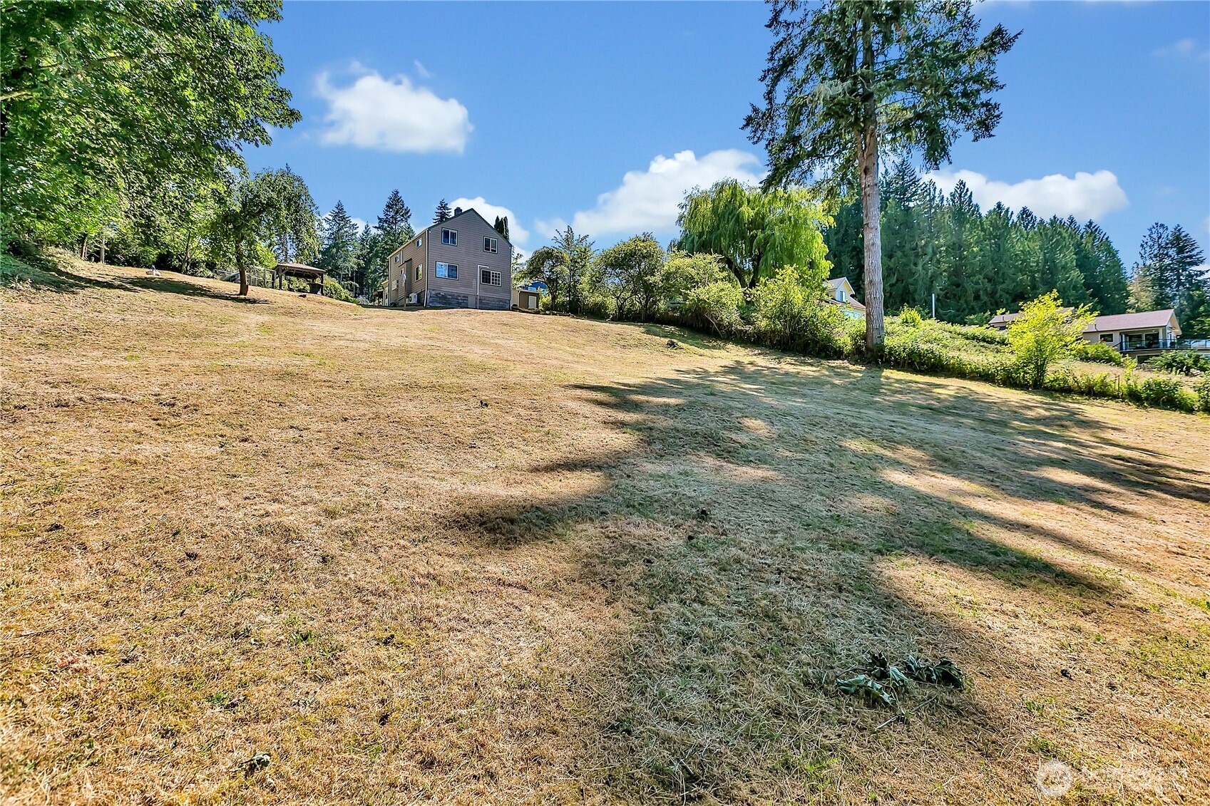 3253 Southeast Arcadia Road Shelton, WA 98584 - Photo 29 of 39 a view of a yard with a house