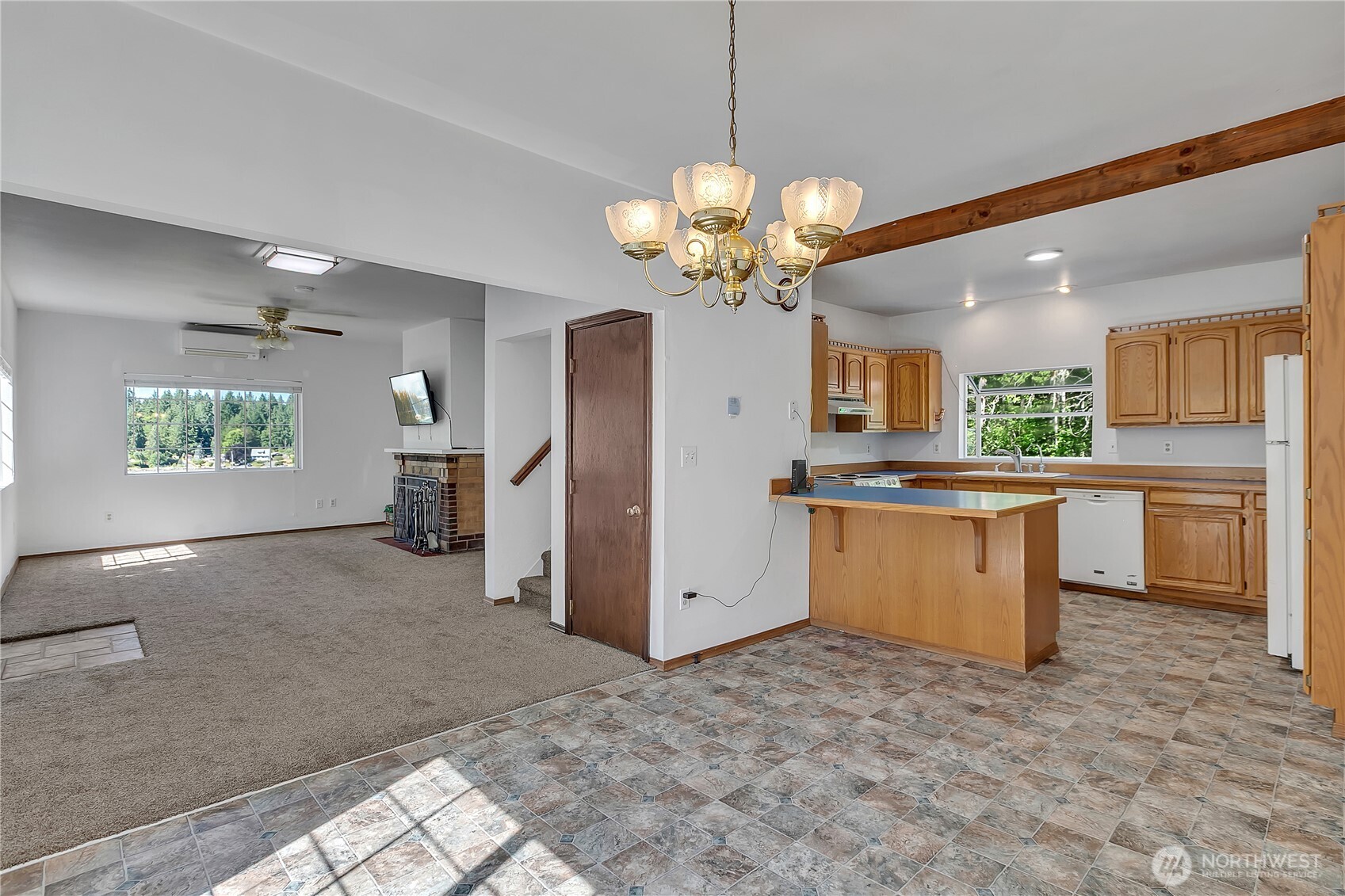 3253 Southeast Arcadia Road Shelton, WA 98584 - Photo 10 of 39 a view of a kitchen with a sink and a refrigerator