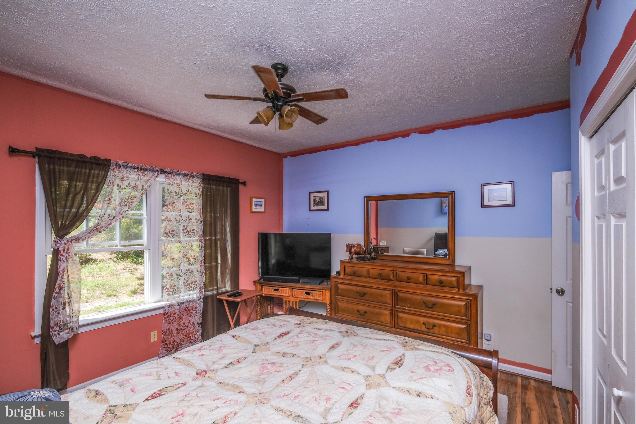 1195 Shangri-La Road Bentonville, VA 22610 - Photo 57 of 64 a bedroom with a bed and flat screen tv