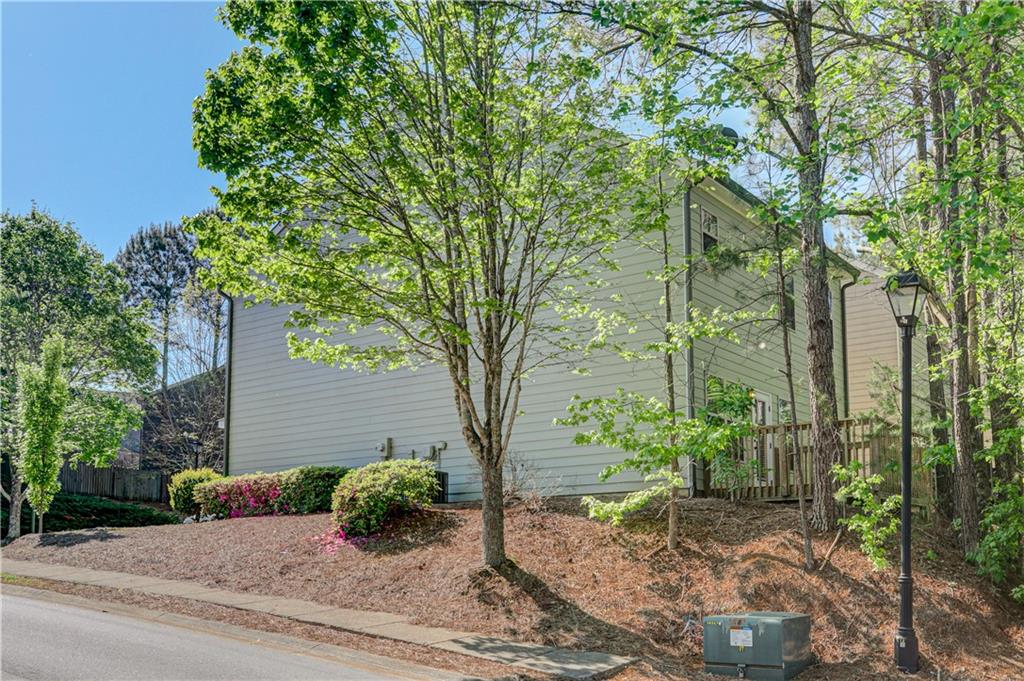 605 Summit Point Canton, GA 30114 - Photo 52 of 56 a backyard of a house with lots of green space