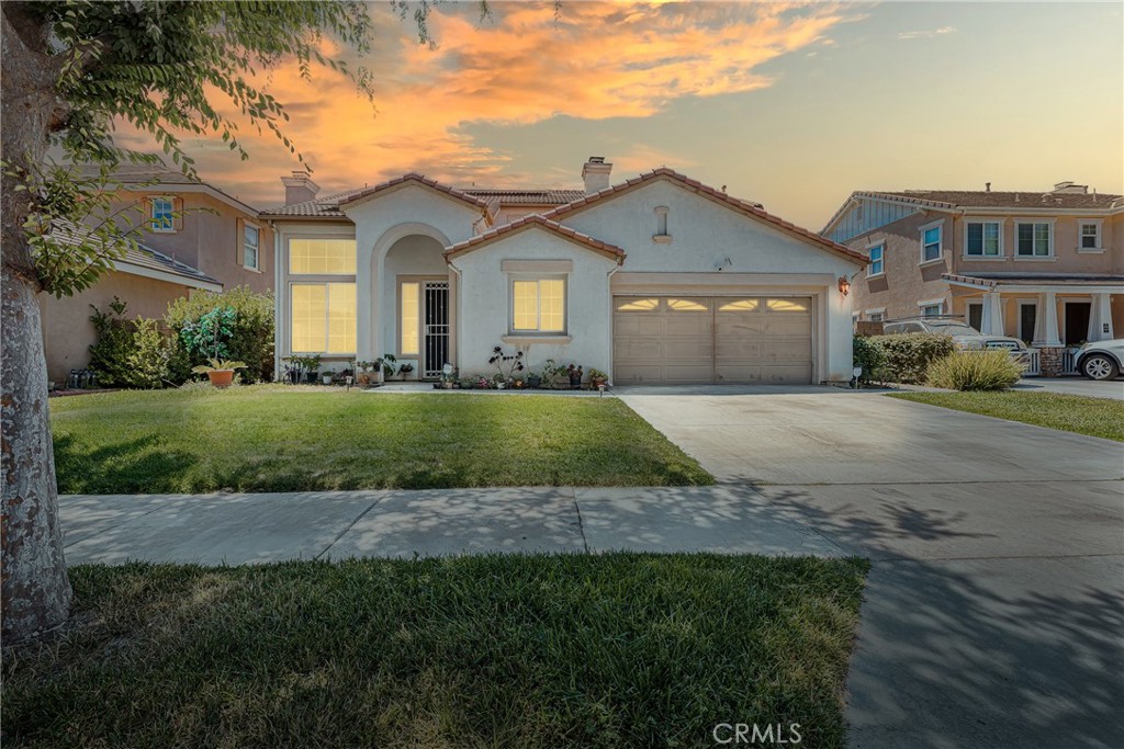 4315 Cloudywing Road Hemet, CA 92545 - Photo 1 of 1 a front view of a house with a yard and garage
