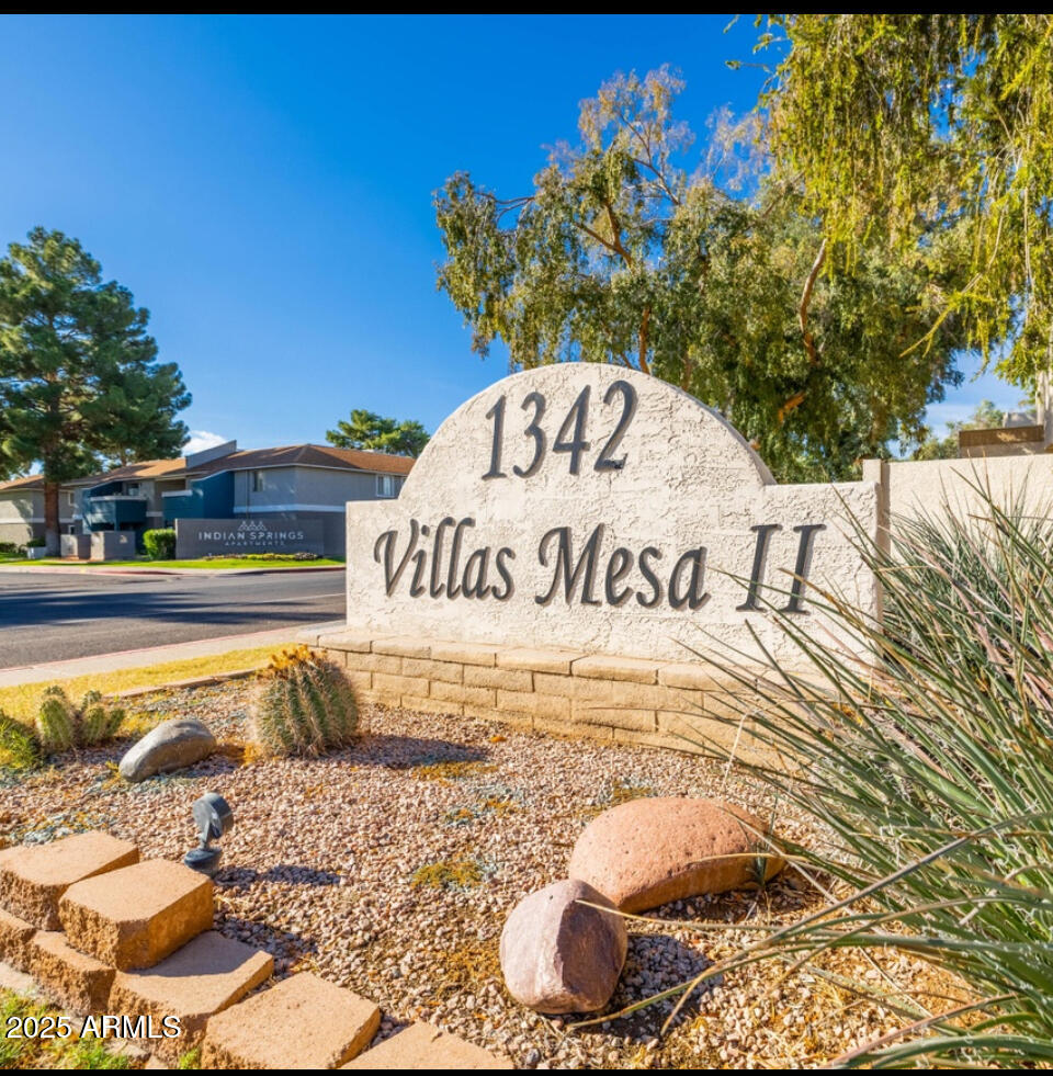 1342 West Emerald Avenue, Unit 329 Mesa, AZ 85202 - Photo 1 of 12 a view of a back yard of the building and a street sign