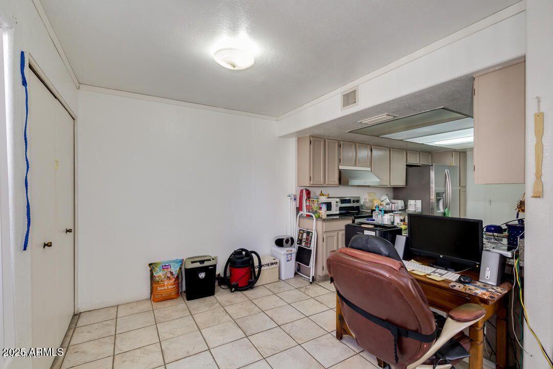 1342 West Emerald Avenue, Unit 329 Mesa, AZ 85202 - Photo 7 of 12 a view of a workspace with furniture and a window