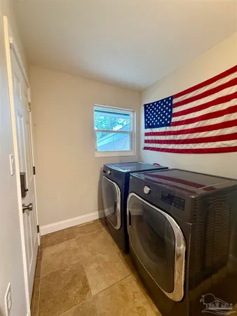 a utility room with dryer and washer