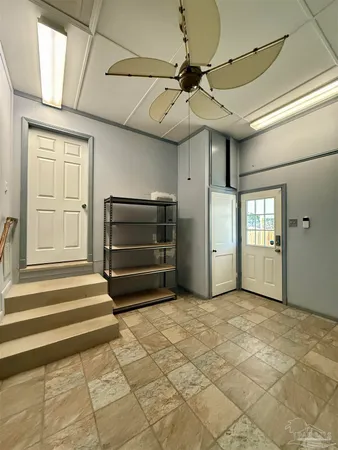 a view of an empty room and a windows