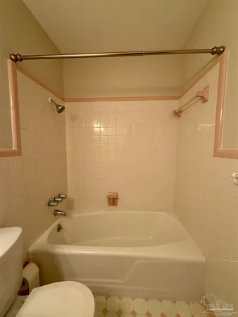 a bathroom with a shower and a toilet