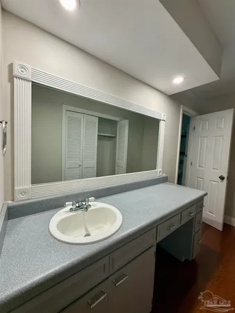 a bathroom with a sink double vanity and a mirror