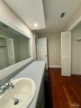 a bathroom with a tub and a sink