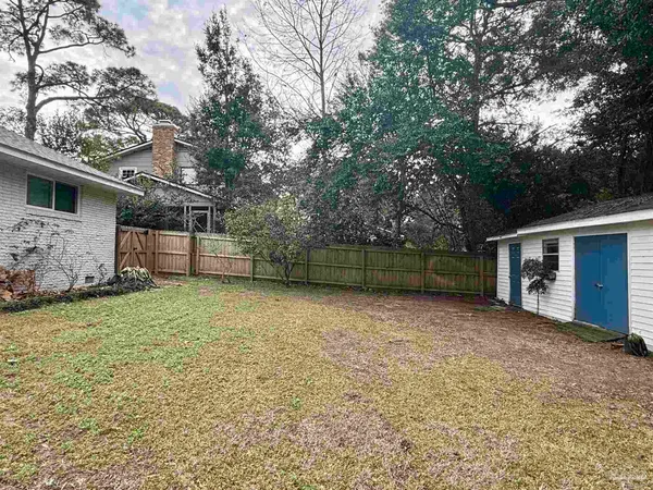 a backyard of a house with lots of green space