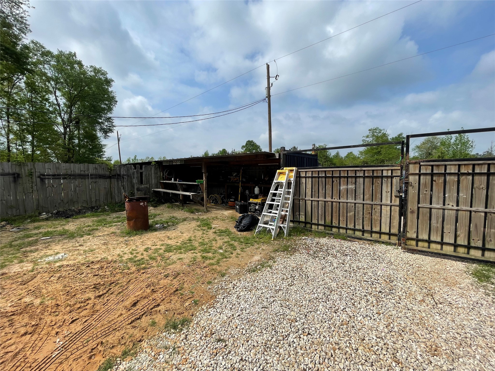 182 Road 5101 Cleveland, TX 77327 - Photo 32 of 35 a view of a garden with a wooden fence