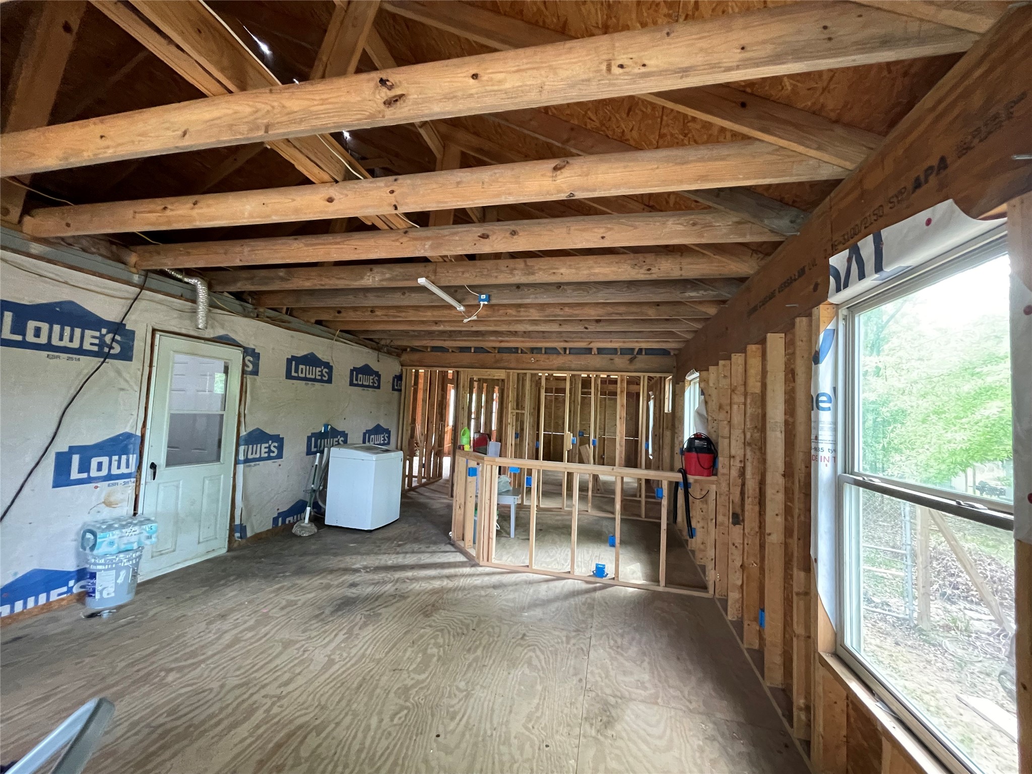 182 Road 5101 Cleveland, TX 77327 - Photo 6 of 35 a view of a room with wooden walls