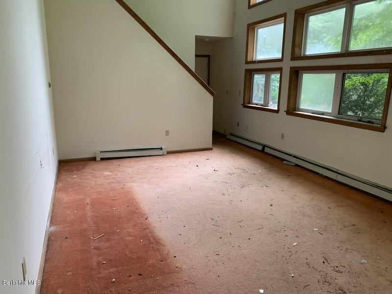 12 Quiet Knoll Road Stockbridge, MA 01266 - Photo 21 of 37 a view of an empty room with a window