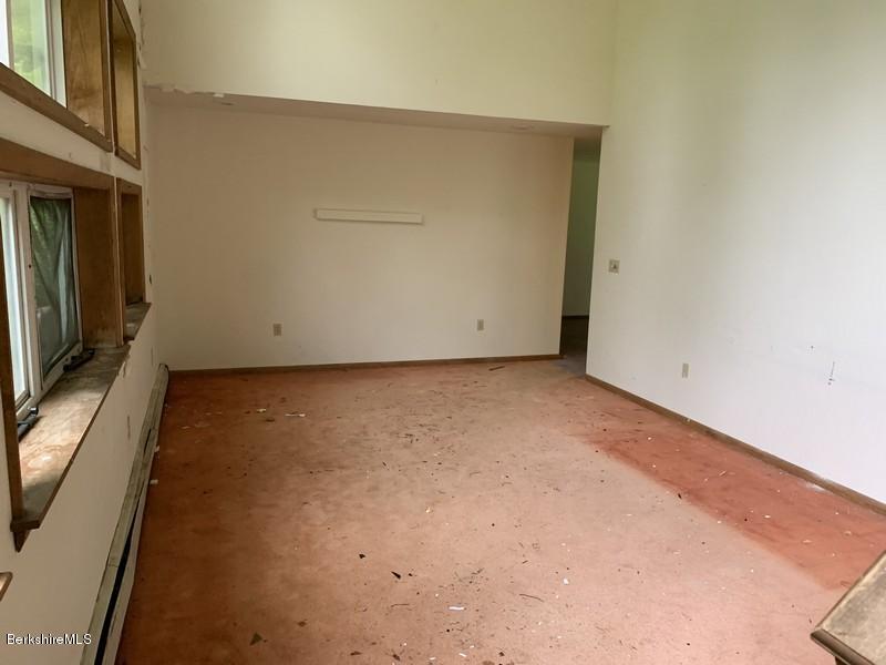 12 Quiet Knoll Road Stockbridge, MA 01266 - Photo 23 of 37 a view of room with window and wooden floor