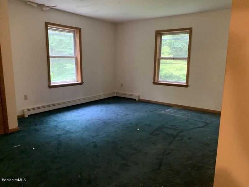 12 Quiet Knoll Road Stockbridge, MA 01266 - Photo 32 of 37 a view of an empty room with hardwood and window
