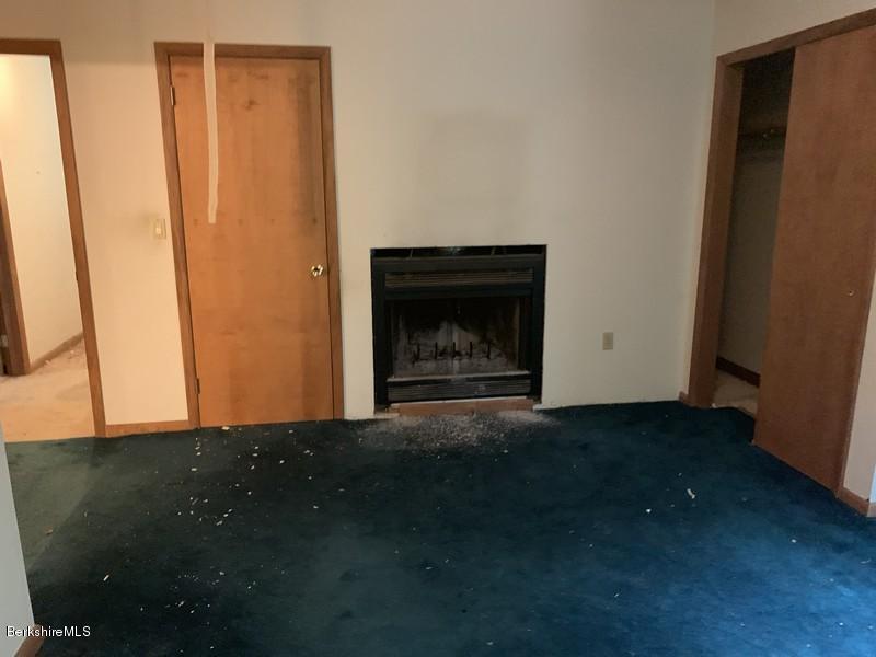 12 Quiet Knoll Road Stockbridge, MA 01266 - Photo 33 of 37 a view of empty room with window and fireplace