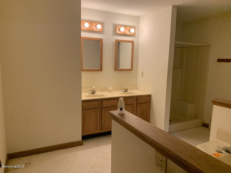 12 Quiet Knoll Road Stockbridge, MA 01266 - Photo 34 of 37 a bathroom with a double vanity sink mirror and toilet