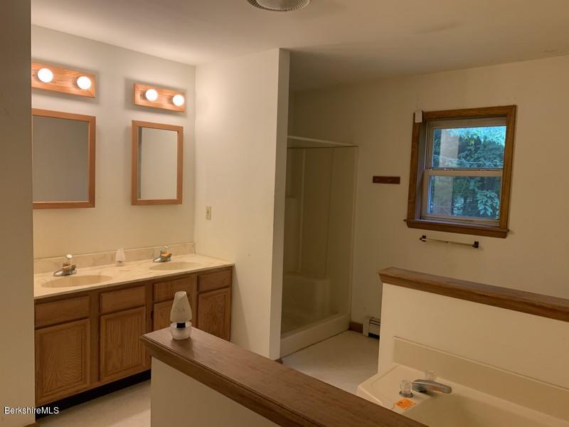 12 Quiet Knoll Road Stockbridge, MA 01266 - Photo 35 of 37 a bathroom with a sink and a mirror