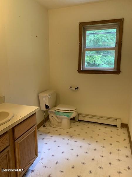 12 Quiet Knoll Road Stockbridge, MA 01266 - Photo 9 of 37 a bathroom with a sink a toilet and a window