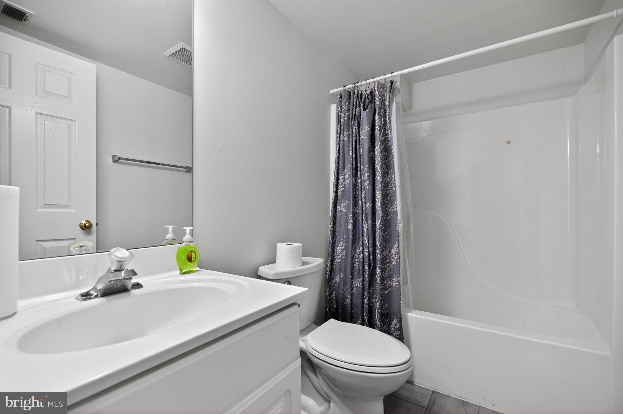 17326 Sligo Loop Dumfries, VA 22026 - Photo 13 of 34 a bathroom with a sink toilet and shower