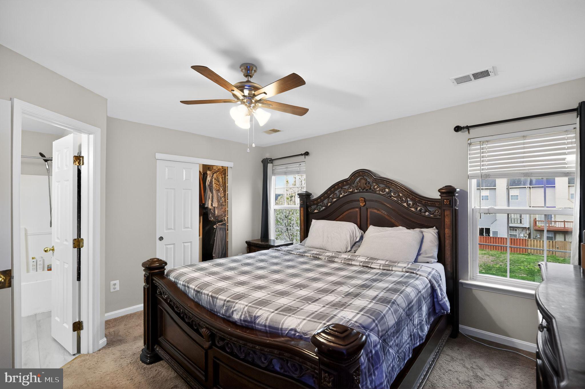 17326 Sligo Loop Dumfries, VA 22026 - Photo 15 of 34 a bedroom with a bed mirror and a window